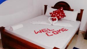 A bed or beds in a room at Priyavimana resort