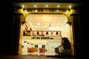 an entrance to a restaurant with a star bar green sign at Cat Ba Green Hotel in Cat Ba