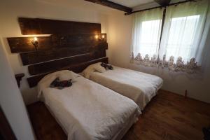 A bed or beds in a room at Pisanata House