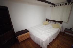 A bed or beds in a room at Pisanata House