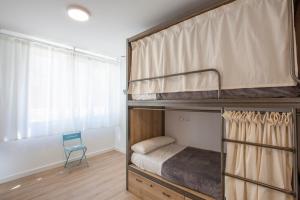 Postel nebo postele na pokoji v ubytování Winederful Hostel & Café
