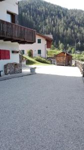 an empty parking lot in front of a building at Casa Simion in Mezzano