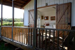a porch with a sliding barn door in a bedroom at Ha Mar ao Luar in Setúbal