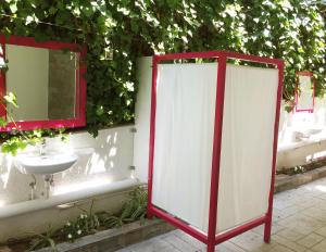 a bathroom with a sink and a mirror at Flower Garden in Mati