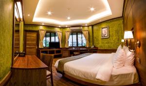 Postel nebo postele na pokoji v ubytování Naiyang Park Resort - SHA Extra Plus