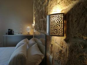 Postel nebo postele na pokoji v ubytování Muragie del Castello B&B