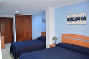 Postel nebo postele na pokoji v ubytování Hotel L'Escala