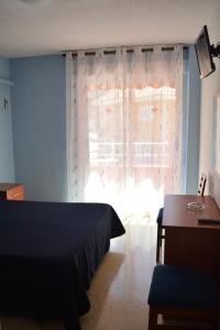 Postel nebo postele na pokoji v ubytování Hotel L'Escala