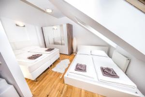 Postel nebo postele na pokoji v ubytování Apartment Untere Viaduktgasse