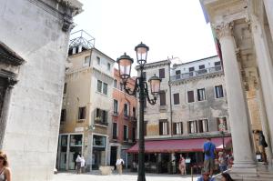 a street light in a city with buildings at Casa Alba in Venice