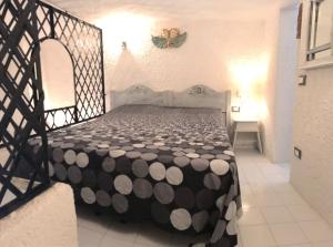A bed or beds in a room at Il Nido 1