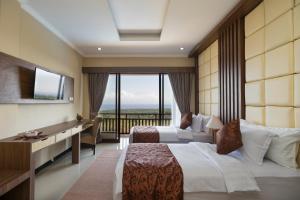 a hotel room with two beds and a balcony at Semabu Hills Hotel Nusa Penida in Nusa Penida