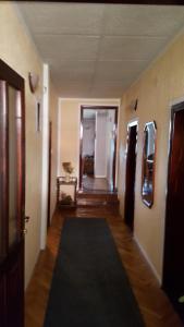 a hallway with a black rug in a room at Vila D&D in Zlatibor