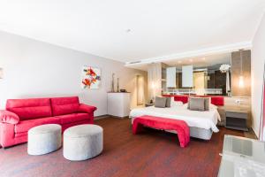 A bed or beds in a room at Lago Garden Apart-Suites & Spa Hotel