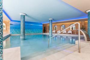 The swimming pool at or close to Lago Garden Apart-Suites & Spa Hotel