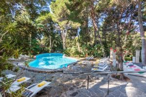 The swimming pool at or close to Lago Garden Apart-Suites & Spa Hotel