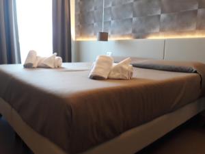 Posteľ alebo postele v izbe v ubytovaní Hotel Palazzo del Garda & Spa