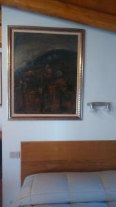 A bed or beds in a room at La Residence da Caterina
