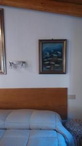 A bed or beds in a room at La Residence da Caterina