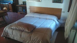 A bed or beds in a room at La Residence da Caterina