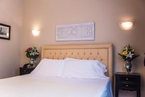 Postel nebo postele na pokoji v ubytování Hotel Patavium