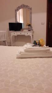 TV a/nebo společenská místnost v ubytování Camere Vacanze Acqua Chiara