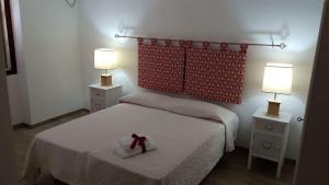 Postel nebo postele na pokoji v ubytování Camere Vacanze Acqua Chiara