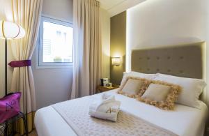 Postel nebo postele na pokoji v ubytování A23 Boutique Hotel