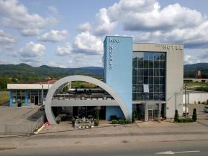 a building with a sign that says next hotel at Hotel Novak in Zvornik