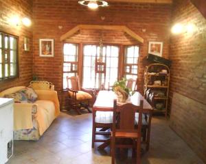 a living room with a couch and a table at Angeluz Paso De La Patria in Paso de la Patria