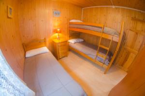 an overhead view of a room with two bunk beds at Camping Playa de Ajo in Ajo