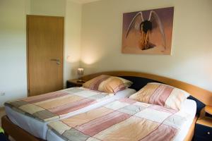 Postel nebo postele na pokoji v ubytování Komfortable Apartments in der Villa Eule
