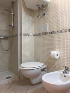 a bathroom with a toilet and a sink and a shower at Sea Home 2 in Monopoli