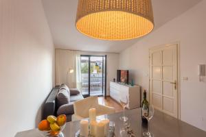 a living room with a couch and a table at Monte & Paradiso in Pula