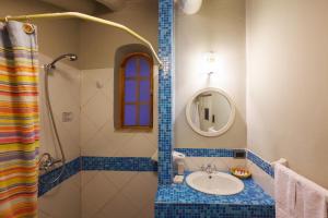 a bathroom with a sink and a mirror at Quinua Boutique Apartments in Cusco +209 photos