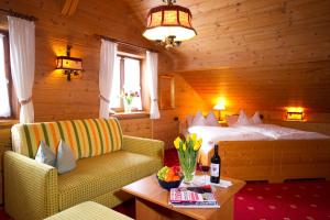 Postel nebo postele na pokoji v ubytování Hotel Leitner