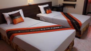 Кровать или кровати в номере Lanna Thai Guesthouse
