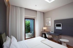 Postel nebo postele na pokoji v ubytování Alter Hotel