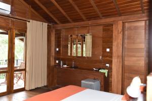 Postel nebo postele na pokoji v ubytování Wilpattu Tree House