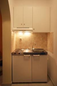 a kitchen with a sink and a counter top at Antonio Studios in Naxos Chora