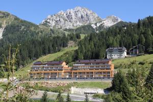 a large building in the middle of a mountain at Haus CKPK Lux in Sonnenalpe Nassfeld