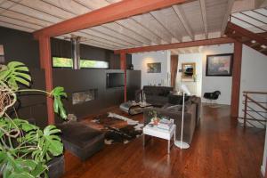 a living room with a couch and a table at Bed and Breakfast Shandita in Mérignac