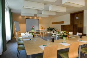 a conference room with a long table and chairs at Jankovich Hotel in Rácalmás +48 photos