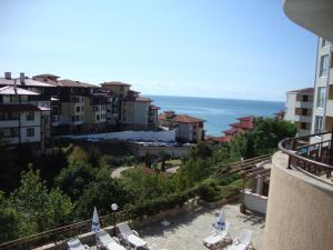 a view of the ocean from the balcony of a building at Sirena Apartment in Sveti Vlas