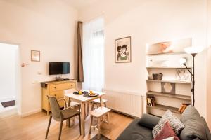 Televízia a/alebo spoločenská miestnosť v ubytovaní BpR Paulay Cozy Apartment