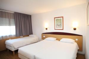 Letto o letti in una camera di Travelodge Barcelona del Vallés