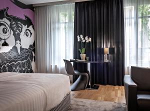A bed or beds in a room at Casati Hotel - Adults Only