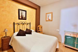 Postel nebo postele na pokoji v ubytování Apartamentos Castillo Cazorla