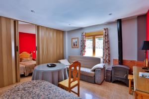 Postel nebo postele na pokoji v ubytování Apartamentos Castillo Cazorla