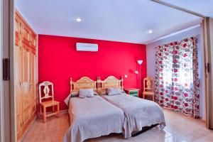 Postel nebo postele na pokoji v ubytování Apartamentos Castillo Cazorla